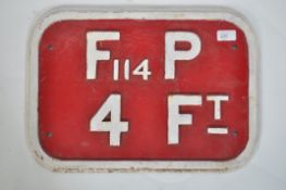 A heavy vintage industrial 20th century cast metal fire sign. Having red ground with raised