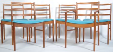A set of 6 1960's McIntosh of Kirkcaldy teak and teal blue vinyl dining chairs. Raised on tapered