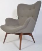 After Ernest Race. A DA1 style armchair raised on turned and tapering supports upholstered in a good