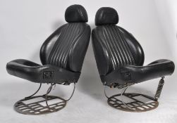 A pair of Industrial leather car chair - armchairs in the manner of Ron Arad being designed and