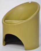 A retro vintage vinyl tub chair designed by Roger Bennett as part of the Gogo antique furniture