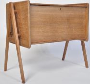 A 1960's Danish mid century teak chest / cabinet on stand in the manner of Robin Day for Hille /
