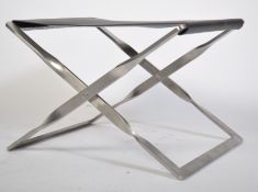 After Poul Kjaerholm. A stunning PK91 black leather and brushed steel folding foot stool /