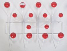 A contemporary Eames style ' Hang It all ' atomic space age revival coat rack set of hooks made of