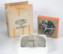 A superb vintage Metamec  mains powered wall clock with black face, white numerals and hands and