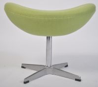 After Arne Jacobsen. A polished steel and green fabric upholstered egg stool - foot stool. The