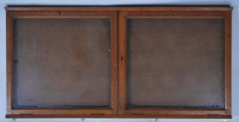 A mid century oak Air Ministry notice board - cabinet contructed of oak with twin glazed doors.