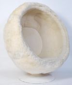 A late 20th Century retro UGG ball chair designed by Eero Saarinen for UGG. Raised on a tulip