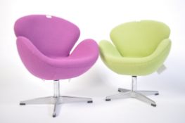 After Arne Jacobsen for Fritz Hansen, a pair of multi-couloured childrens Swan chairs - armchairs.