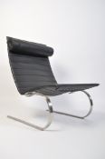 After Poul Kjaerholm, a stunning black leather and polished steel PK20 armchair / chair. Raised on