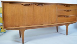 A 1970's teak wood Danish inspired sideboard of small proportions having tapered legs with a