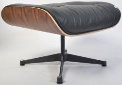 After Charles & Ray Eames. A Herman Miller  671 Ottoman raised on polished quadruped swivel base