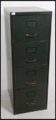 A 1950's mid century green metal 4 drawer filing cabinet with coachlined detail to the drawer fronts