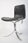 After Poul Volther. A stunning black leather and polished steel open armchair. The splayed