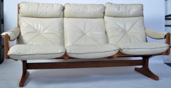 A Danish mid century teak and leather slatted sofa settee having a stunning bentwood slatted back