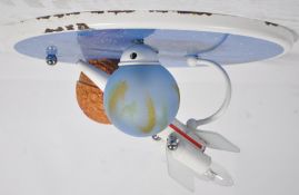 A stunning retro atomic space travel inspired ceiling light fixture having two shades in the form of