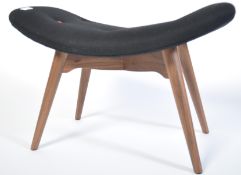 After Finn Juhl, a stunning footstool ottoman - window seat being raised on tapering turned legs