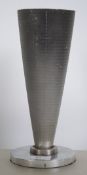 An exceptionally rare air filter from a jet engine being inverse mounted and set to a polished metal