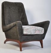 A 1960's Greaves & Thomas teak wood armchair. The base of teak with stunning low show wood frame