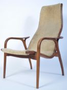 A 20th century Yngve Ekstrom beech framed lamino easy chair - armchair with believed fabric