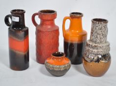 A collection of 1970's German ' Fat Lava ' type ceramics to include vibrant colours to the jugs /