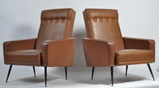 A good pair of 1950's mid century retro patch vinyl and button backed Pan-Am style armchairs of