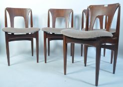 A set of 4 1950's teak dining chairs in the manner of Poul Volther raised on tapered legs with upper