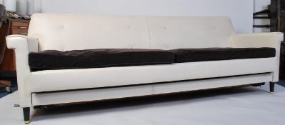 A  retro 1960's   of Greaves & Thomas ' Longline ' vinyl sofa settee. Raised on tapering ebonised