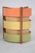 A vintage mid 20th century retro lampshade of circular wooden construction having painted and rattan