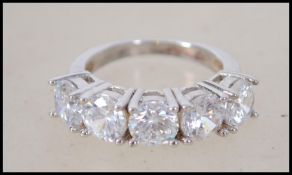 A 925 silver and CZ 5 stone dress ring. Size N.5.