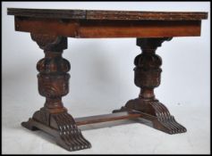 A 1940's oak draw leaf extending refectory dining