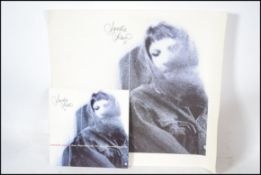 A signed Sandie Shaw artwork and 7