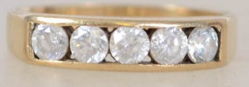 A 9ct gold 5 stone diamond ring being channel set