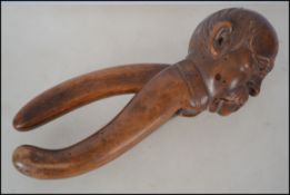 A large pair of 19th century treen worked nut crac