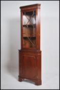 An antique  Georgian style mahogany corner display