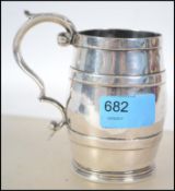 An unusual silver plated half pint measure bearing