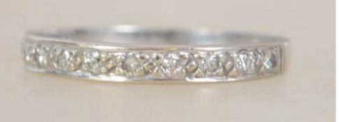 An 18ct white gold and diamond ladies half eternit