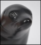 A Royal Dux figure of a seal with pink triangle br