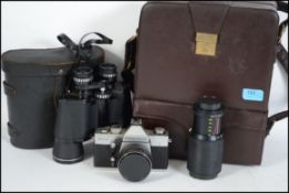 A cased vintage 35mm Practica camera and lenses to