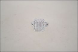 A 925 silver dress ring set with baguette CZ . Wei