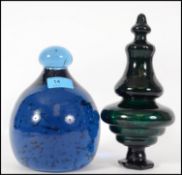 A large end of day blue dump glass with air bubble