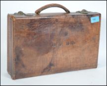 A early 20th century crocodile skin brief case / w