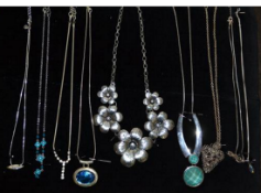 A group of costume jewellery and silver necklaces