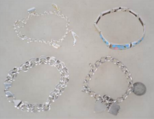 A collection of 4 silver bracelets to include double hoop with lobster clasp, charm bracelet with