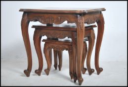A set of three Chinese hard wood nest of tables ca