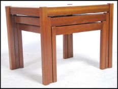 A 1970's G-Plan teak wood and tile top nest of tab