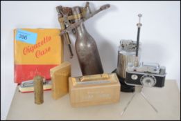 A collection of cigarette lighters to include a li