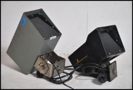 2 20th century Industrial street pedestrian sensors - motion sensors, one in grey and one in black