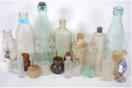 A collection of bottles, ink pots etc. Dating from