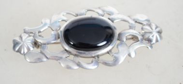 A vintage silver and black onyx brooch of Celtic s